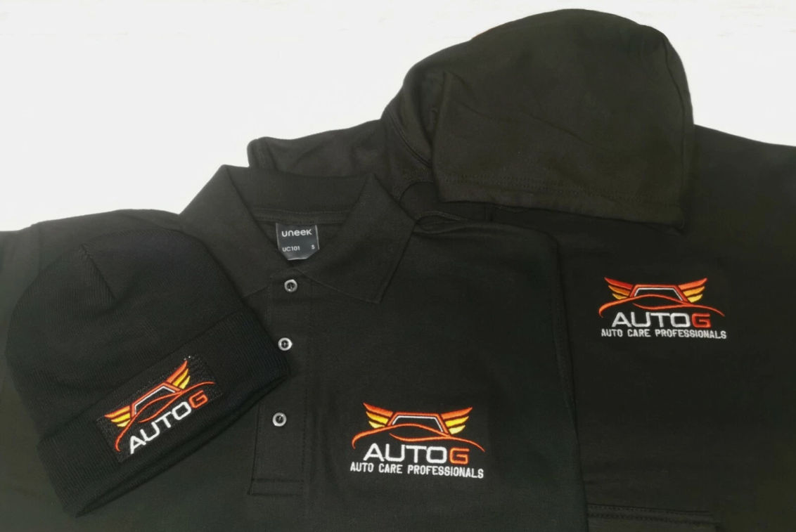 Black jacket and cap with 'AUTO G' logo on a white background