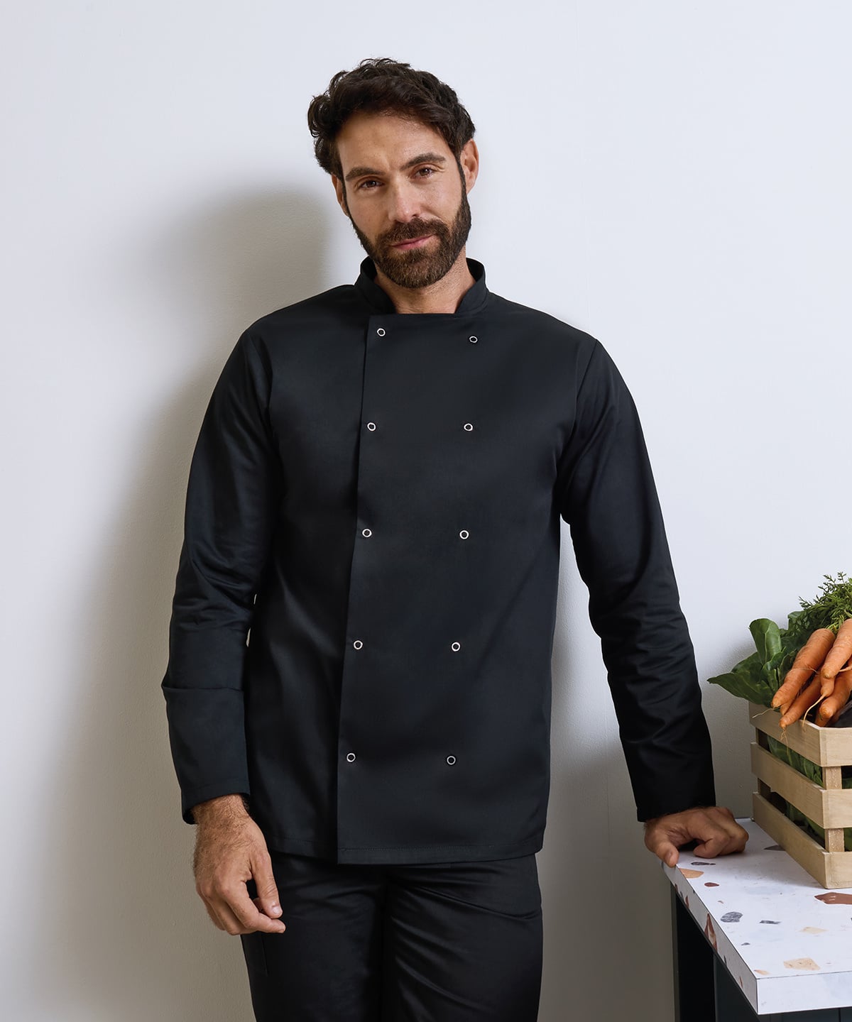 chef wearing a black chef's coat by ARKWORKWEAR UK