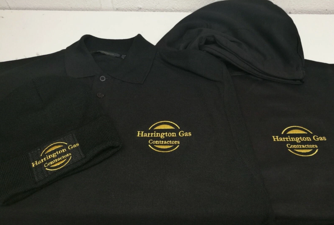Black polo shirts with Harrington Gas Contractors logo on a white background