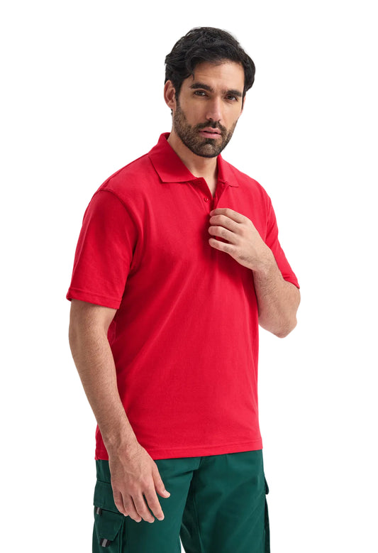 Man wearing a red Uneek UC105 polo shirt and green pants on a white background