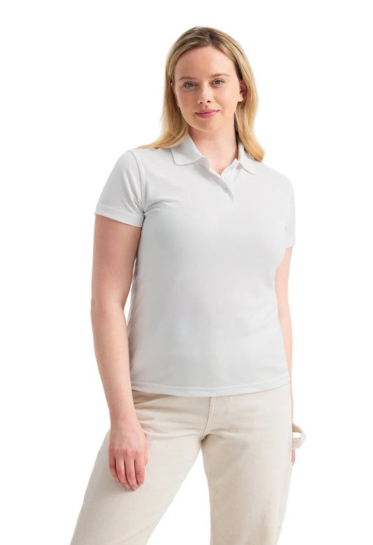 Woman wearing a Uneek UC128 white polo shirt and beige pants on a light gray background