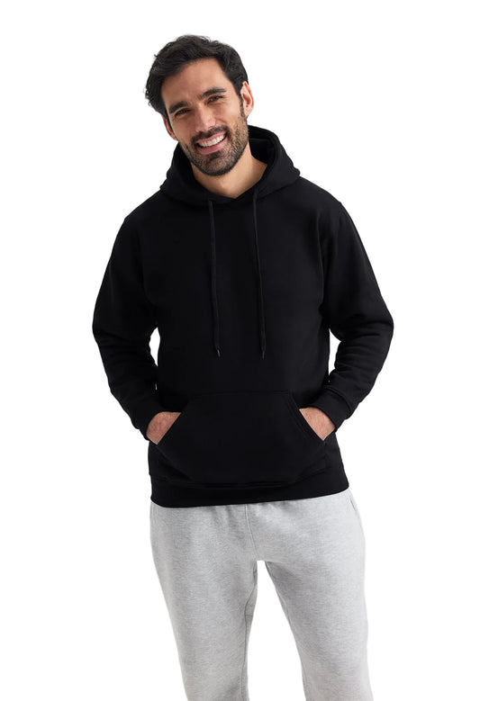 Man wearing a Uneek UC501  black hoodie and gray pants on a white background